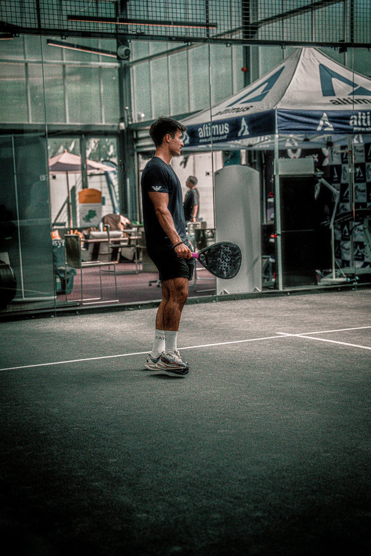 12k Padel Midnight Black racket on court, photographed during the Find Padel UK review