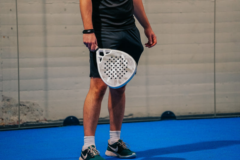 12K Padel racket on a blue padel court