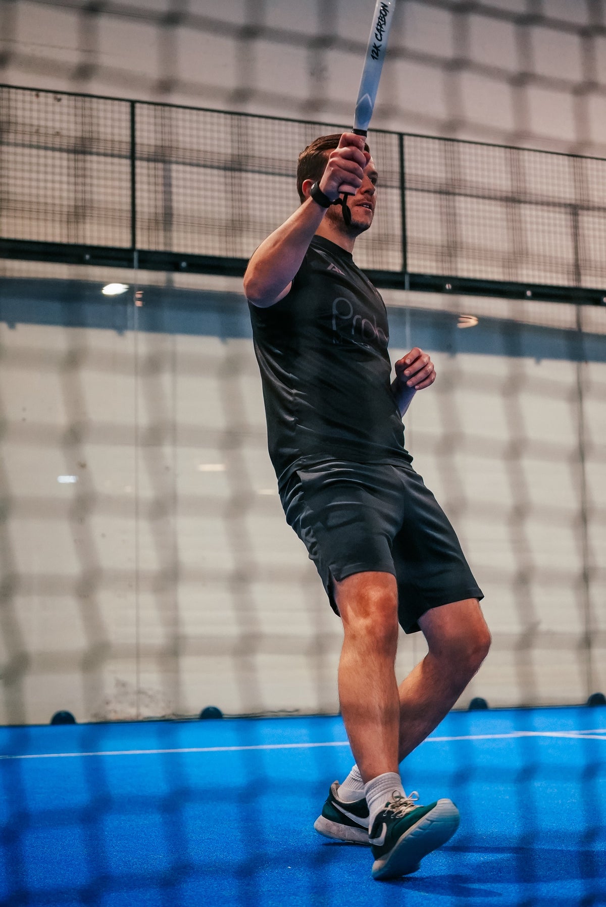 12K Padel racket on a blue padel court