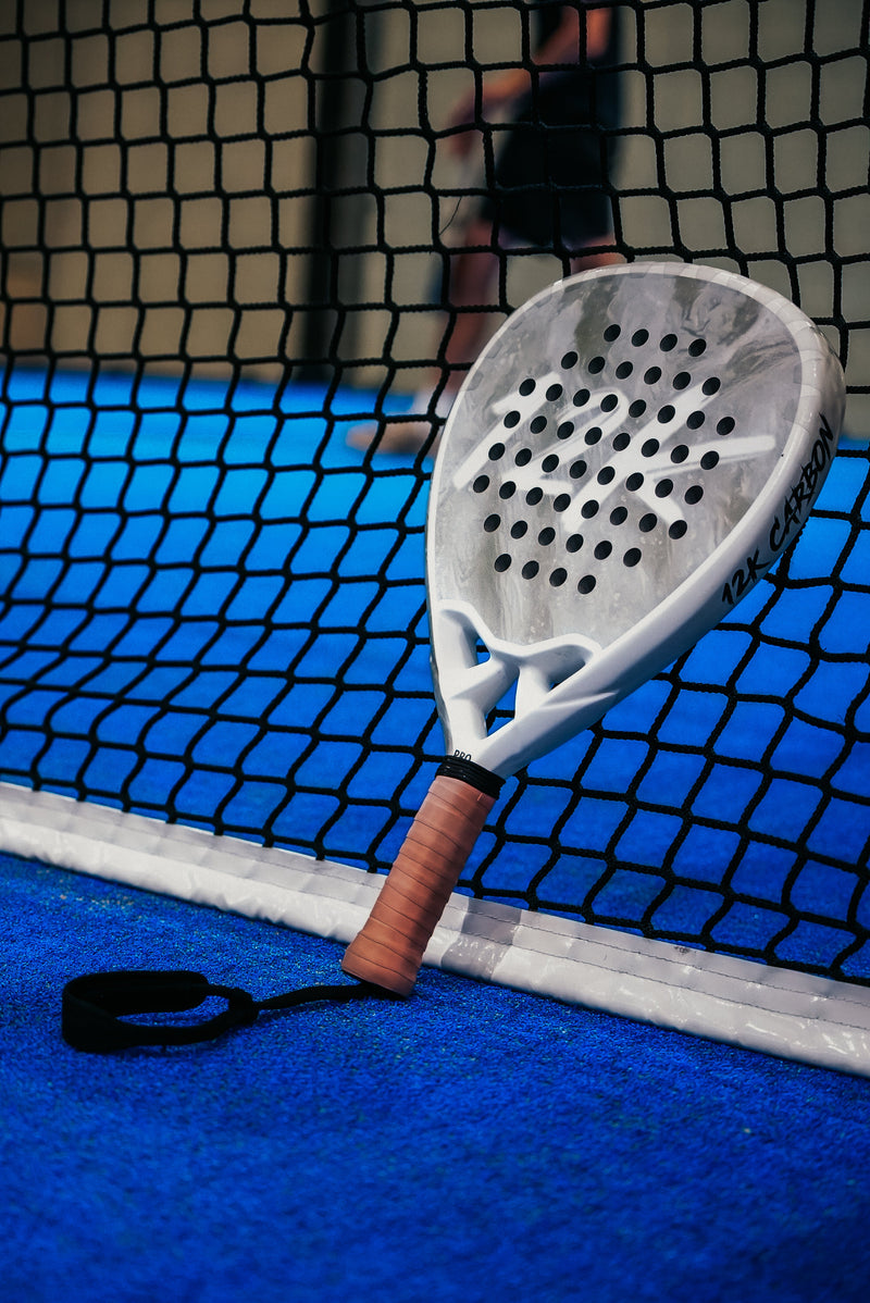 12K Padel racket on a blue padel court