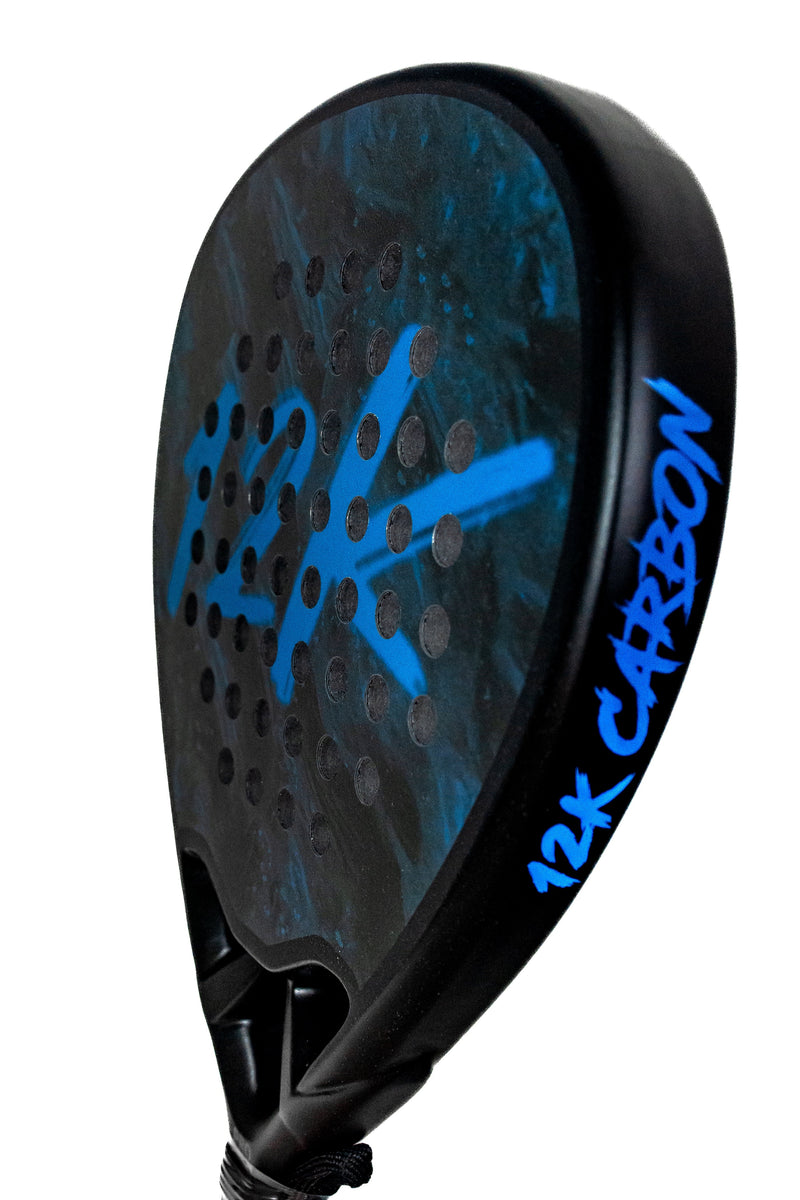 Padel player holding a carbon padel racket on court