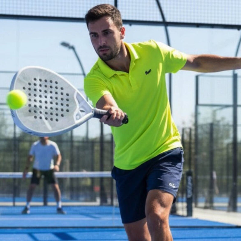 Padel player holding a racket with a built-up grip on court