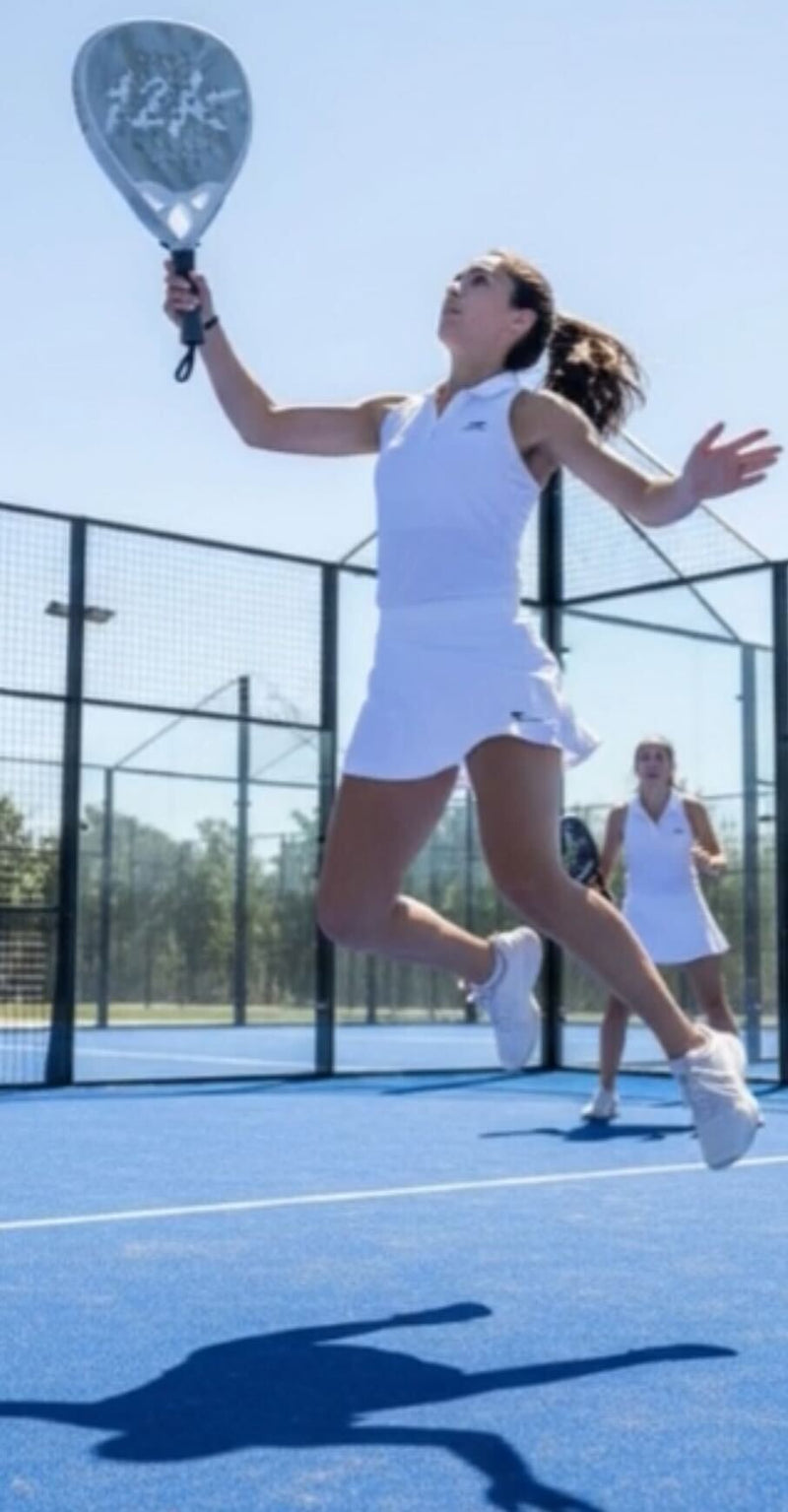 Padel player lining up a shot on an enclosed padel court