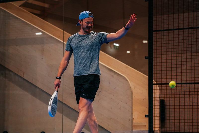Padel player on court with a 12K Padel racket