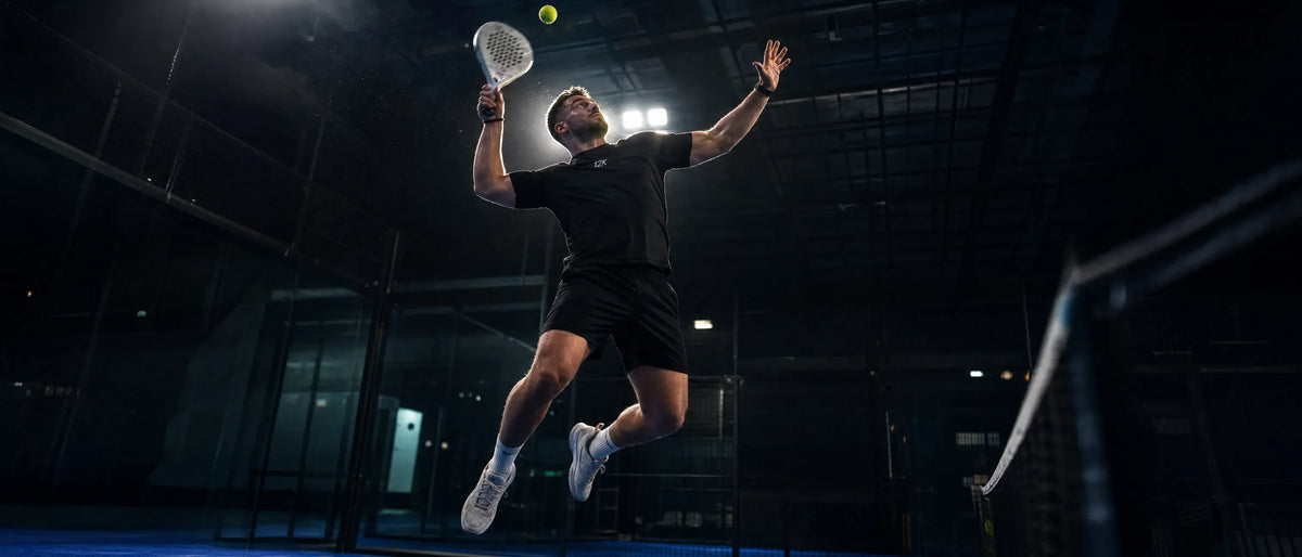 Padel player jumping for an overhead smash with a 12k Padel carbon racket