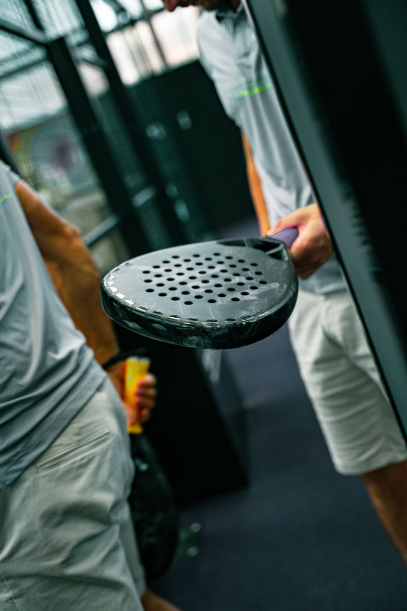 12k Padel Midnight Black racket on court, photographed during the Find Padel UK review