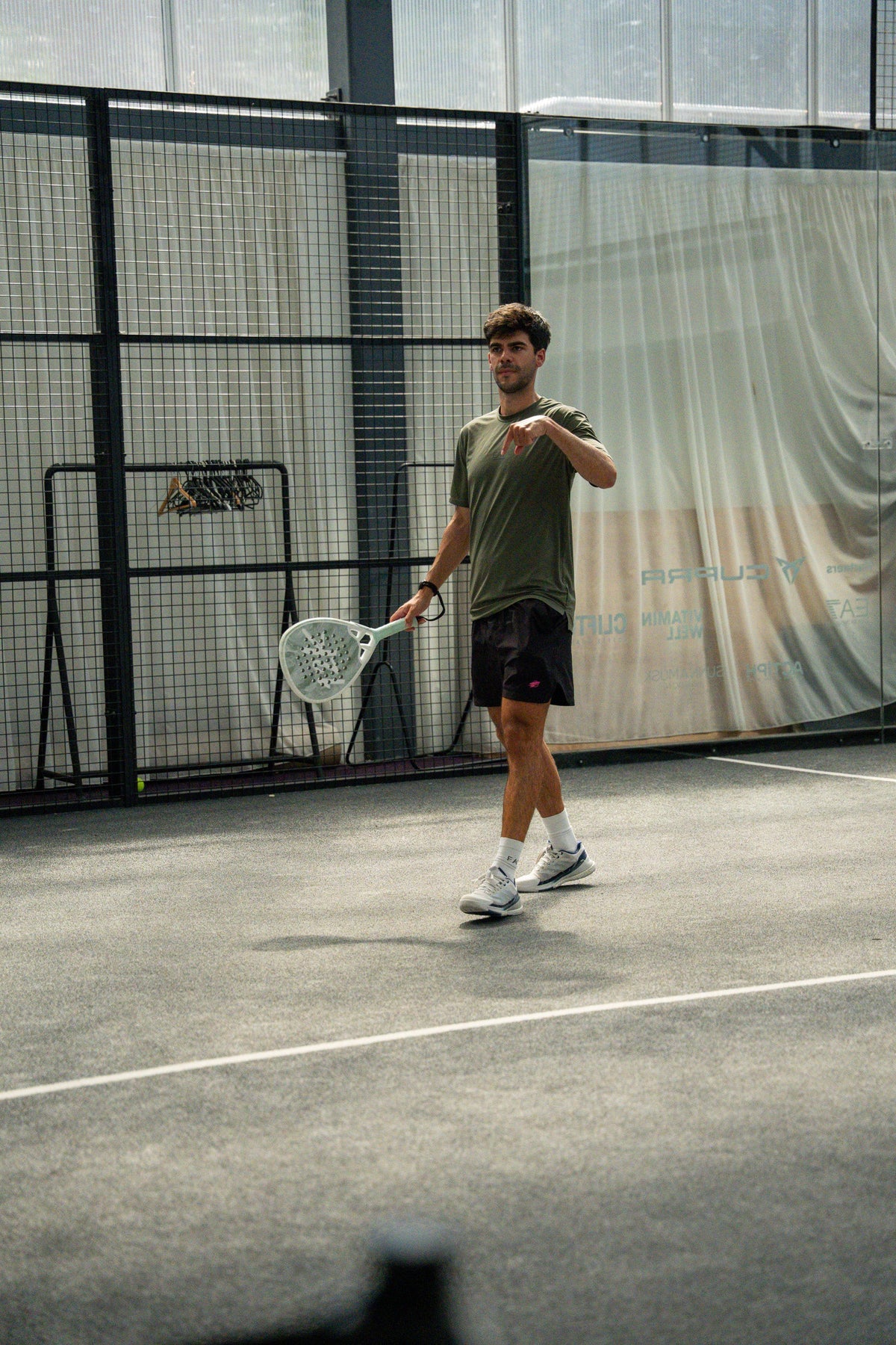 12k Padel Midnight Black racket on court, photographed during the Find Padel UK review
