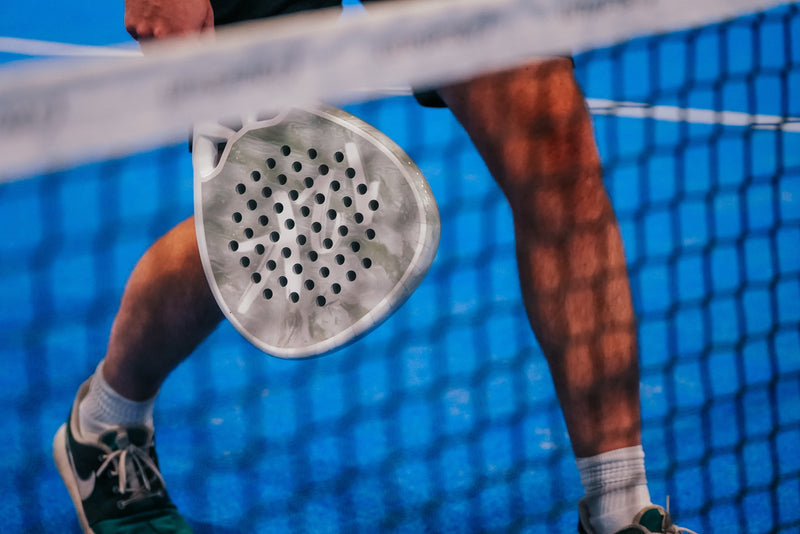 12K Padel racket on a blue padel court