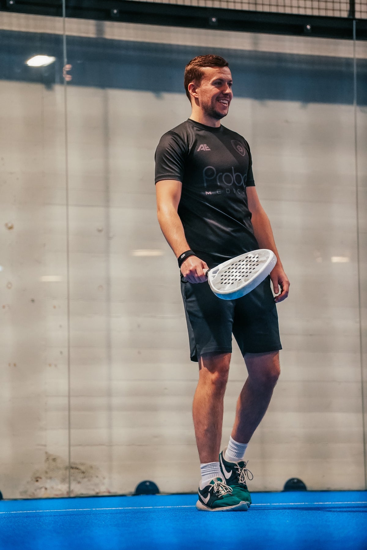 Padel players on court during a social doubles session in the UK