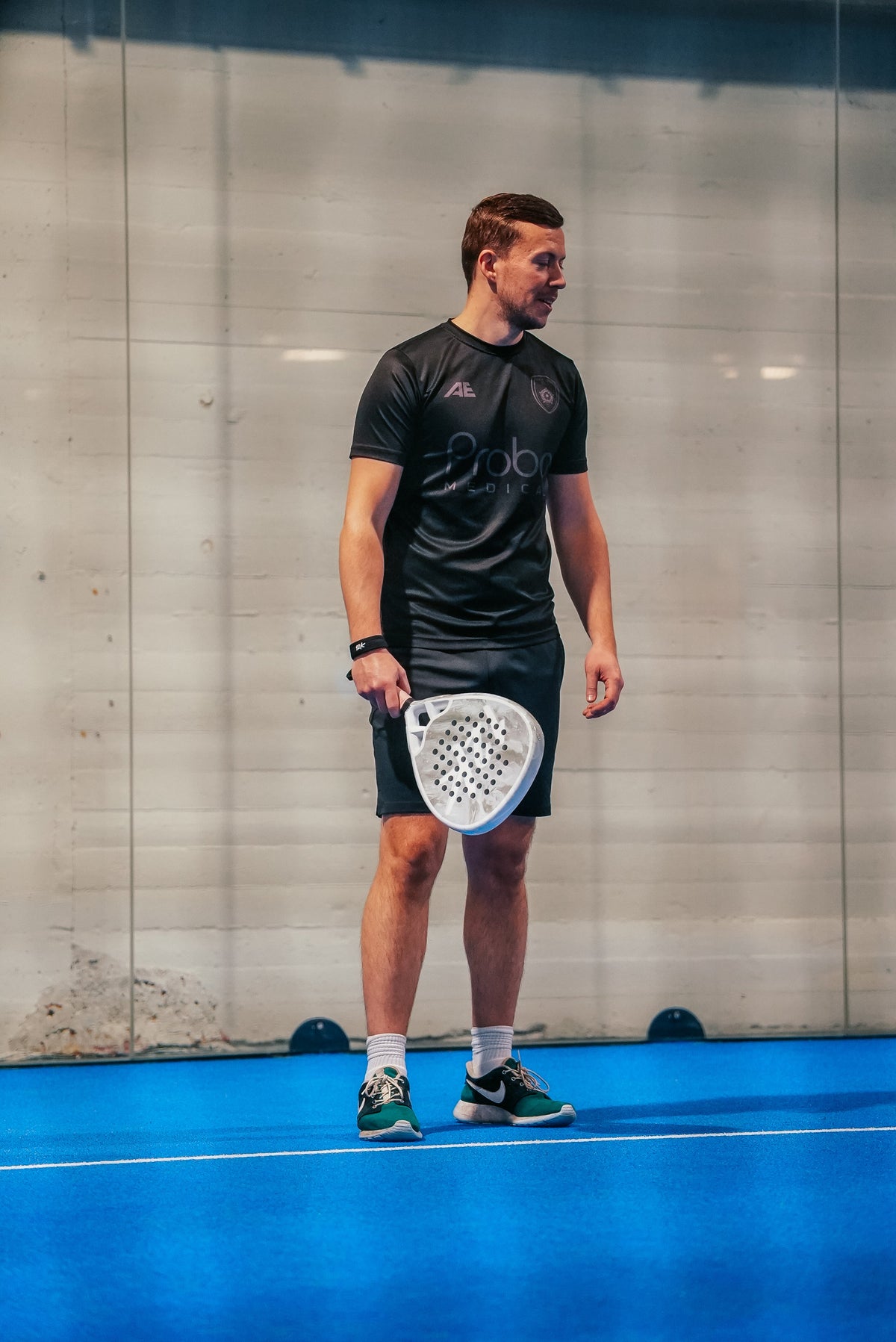 12K Padel racket on a blue padel court