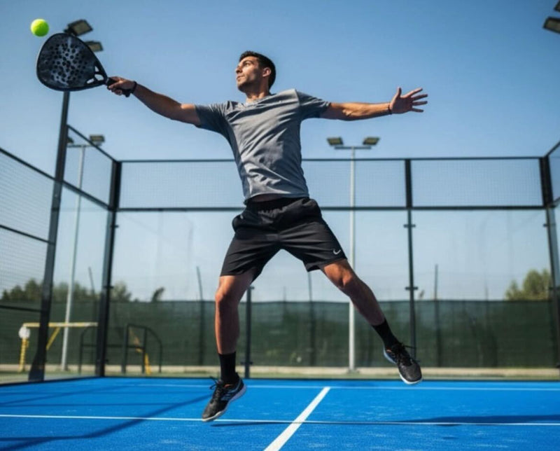Padel player on court preparing to hit the ball